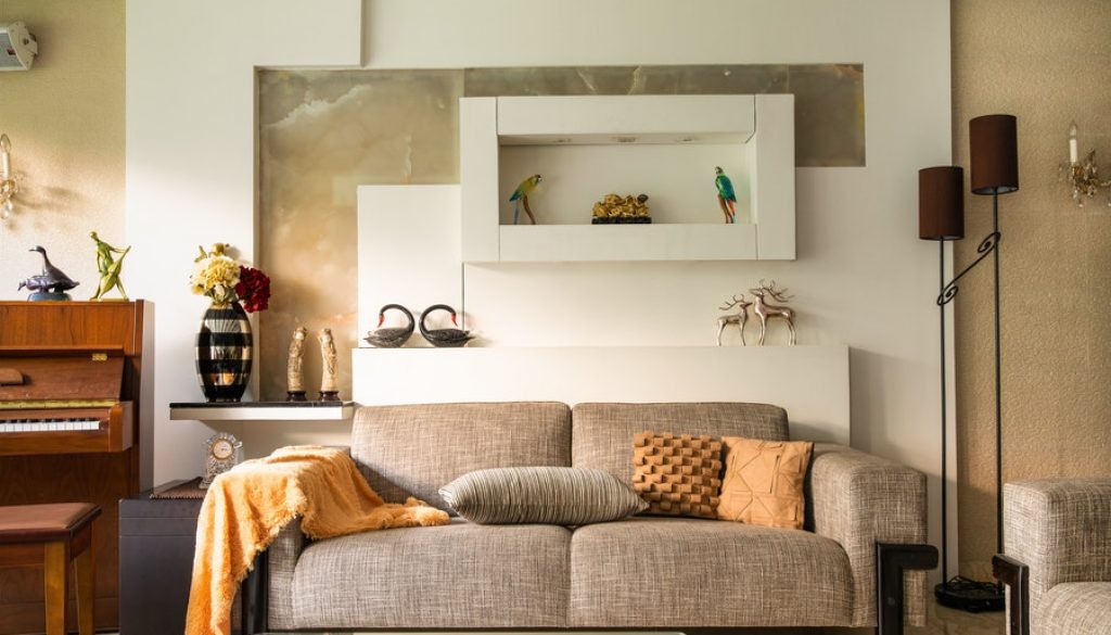 Interior Designers in Mangalore Create a Cozy Living Room with a Piano and Sofa